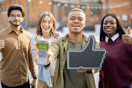 students-with-corona-vaccination-app-and-thumb-up-